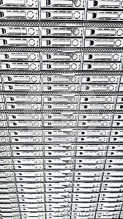 High capacity hard drive disk storage rack used for big data cloud services inside data server room Stock Photo