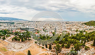 High cityscape view from Acropolis hill with ruined amphitheater and national museum on foreground Stock Photo