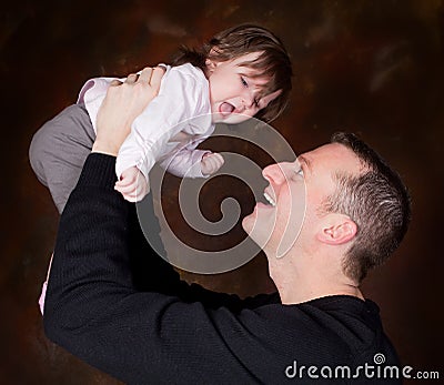 High in dad's hands Stock Photo