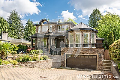High end family home with rotunda above double garage Stock Photo