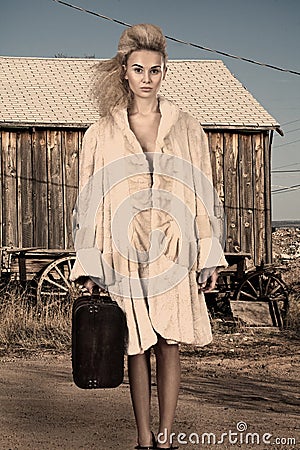 High fashion model with luggage Stock Photo