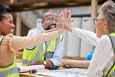 High five, meeting and architecture people with meeting success, blueprint collaboration and teamwork or support Stock Photo