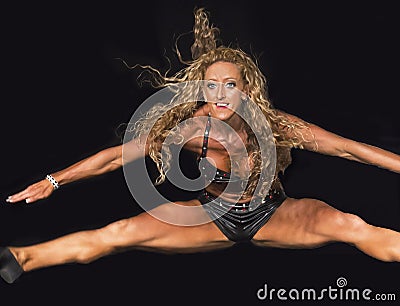 High-Flying Fitness Athlete with Curly Blonde Hair Askew Editorial Stock Photo