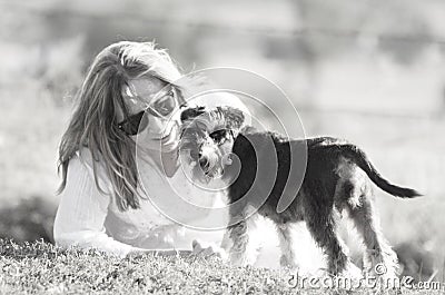 High-key soft dreamy love tenderness woman and pet puppy dog Stock Photo