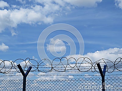 High Metallic Protection Perimeter Fence Railing with Barbed Wire on Top Stock Photo