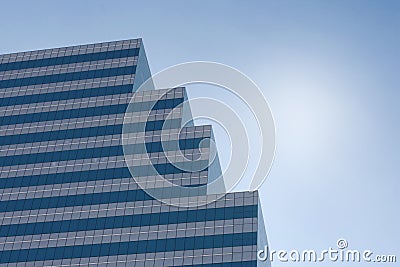 A high modern tower standing against sky in midday Stock Photo