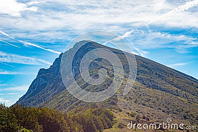 High mountain peak with its mountain range Stock Photo