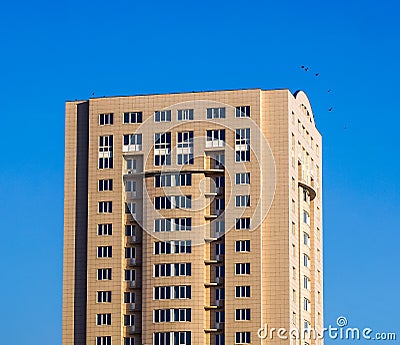 High multi storey building against blue sky in sunny day Editorial Stock Photo