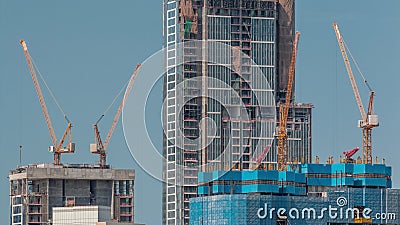 High multi-storey buildings under construction and cranes timelapse Editorial Stock Photo