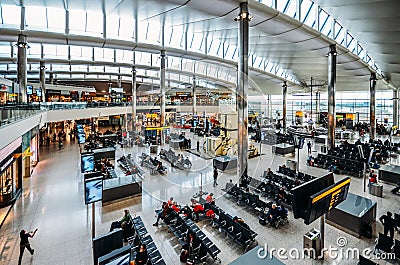 High perspective view of passengers and shops at departure terminal at Heathrow Terminal 3 in London, UK Editorial Stock Photo