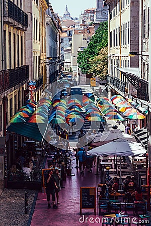 High perspective view of people walking on the Pink Street of Lisbon in the Cais do Sodre Editorial Stock Photo