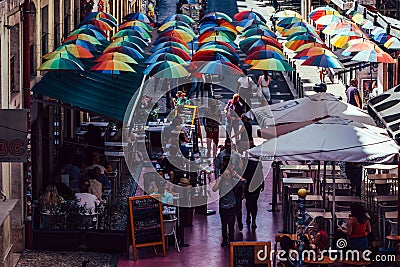 High perspective view of people walking on the Pink Street of Lisbon in the Cais do Sodre Editorial Stock Photo