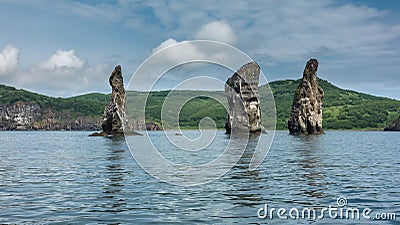 High picturesque cliffs rise above the ocean. Stock Photo