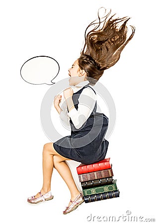 High point of view of little girl sitting on books and shouting Stock Photo