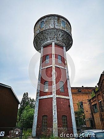 High red brick tower as part of old factory complex Stock Photo