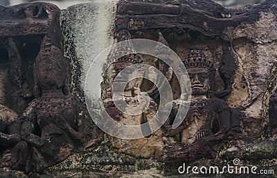 High relief sandstone carvings around the walls of Angkor Wat in Siem Reap Stock Photo