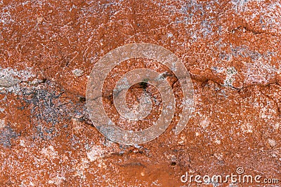 High res dark orange rough and weathered stone with white patches Stock Photo