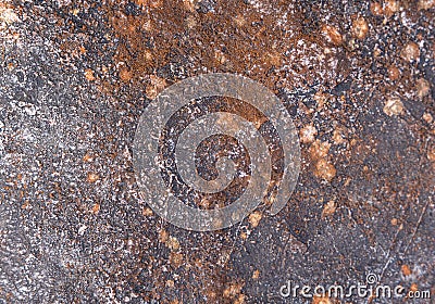 high res grunge and weathered dark natural stone with small light warm brown spots texture close up background Stock Photo