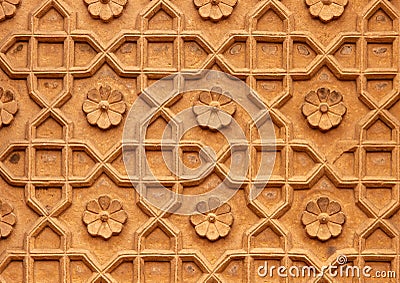 High res natural bright pale sandstone door inlaid with intricate floral and geometric relief arabesque decorative pane Stock Photo