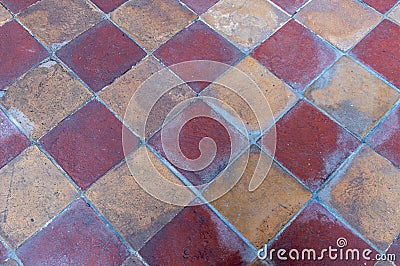 High res weathered geometrical square earth tone colored pale terracotta tiles background floor Stock Photo