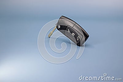 High resolution photo in 8k, car key on blue and white background, car open, close, trunk open symbol on black key, crop Stock Photo