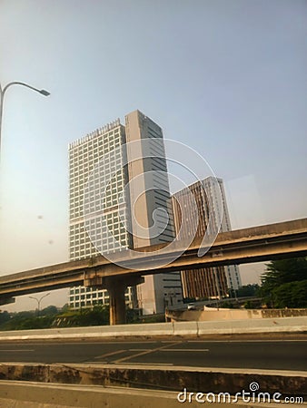 High-rise building on the edge of the toll road in downtown Jakarta Editorial Stock Photo