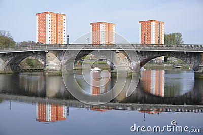 High rise orange council flats in Dumbarton next to River Leven Stock Photo