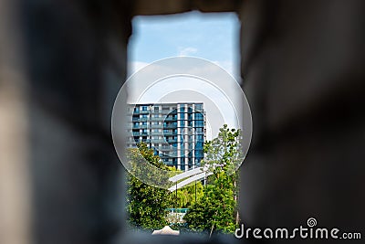 High-rise in the trees through the window. Jinhua. China Stock Photo