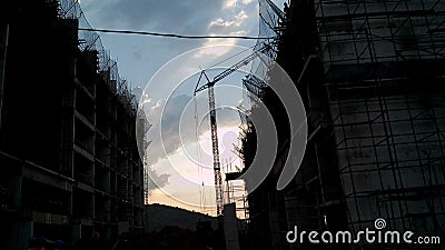 A high rising building construction under progress at the time of evening. Stock Photo