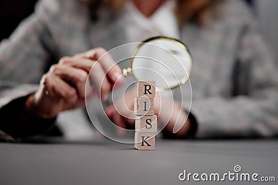 High-risk Detection: Magnifying the Word 'Risks' Stock Photo