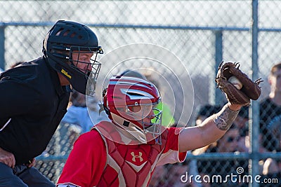High School Baseball catcher catches the pitch Editorial Stock Photo