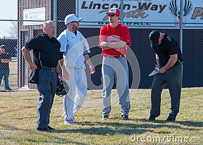 High school baseball coaches and umpires Editorial Stock Photo