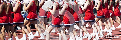High school cheerleaders cheering during a football game Editorial Stock Photo