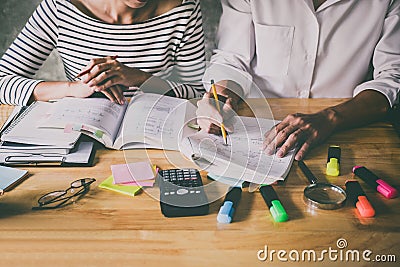 High school or college Asian student group sitting at desk in cl Stock Photo