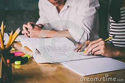 High school or college student group catching up workbook and le Stock Photo