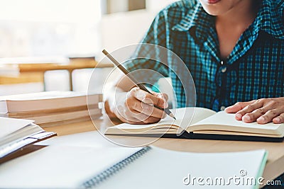 High school or college student studying and reading together in Stock Photo