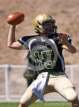 High School Football Quarterback Passing the Ball Editorial Stock Photo