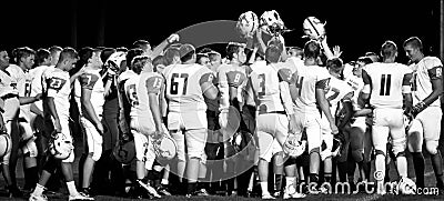 High School Football Team Huddle Banner Editorial Stock Photo