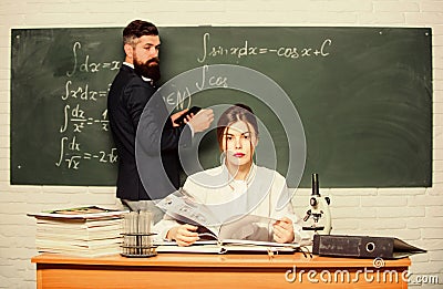 High school. Solving task. Man writing on chalkboard math formulas. Teaching in university. University education Stock Photo
