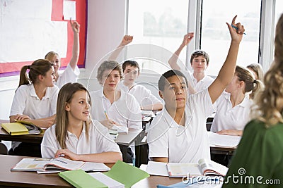 High school students answering a question Stock Photo