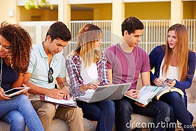 High School Students Collaborating On Project On Campus Stock Photo