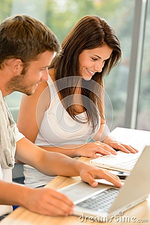 High-school students working on laptops in study Stock Photo