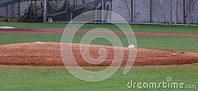 Pitchers mound with rosin bag on a turf infield Stock Photo