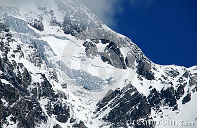 High snow and rocky mountain range Stock Photo