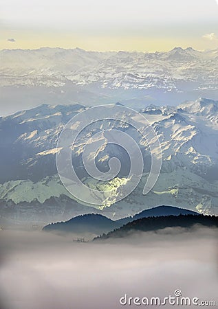 High snowy mountains above clouds Stock Photo