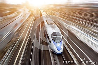 High-speed passenger train travels at high speed. Top view with motion effect, greased background. Stock Photo