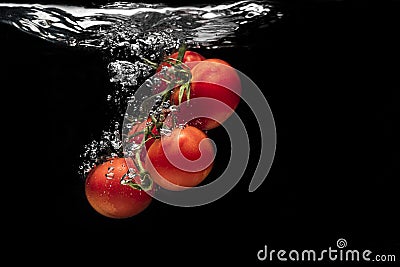 High speed photography tomato splash in water Stock Photo