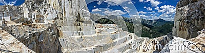 High stone mountain and marble quarries in the Apennines in Tuscany. Open marble mining Stock Photo