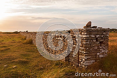 High stone wall in sunset Stock Photo
