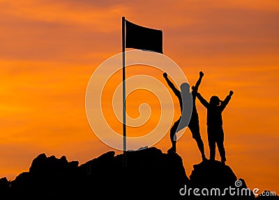 High success, Two people silhouette make high hand Stock Photo